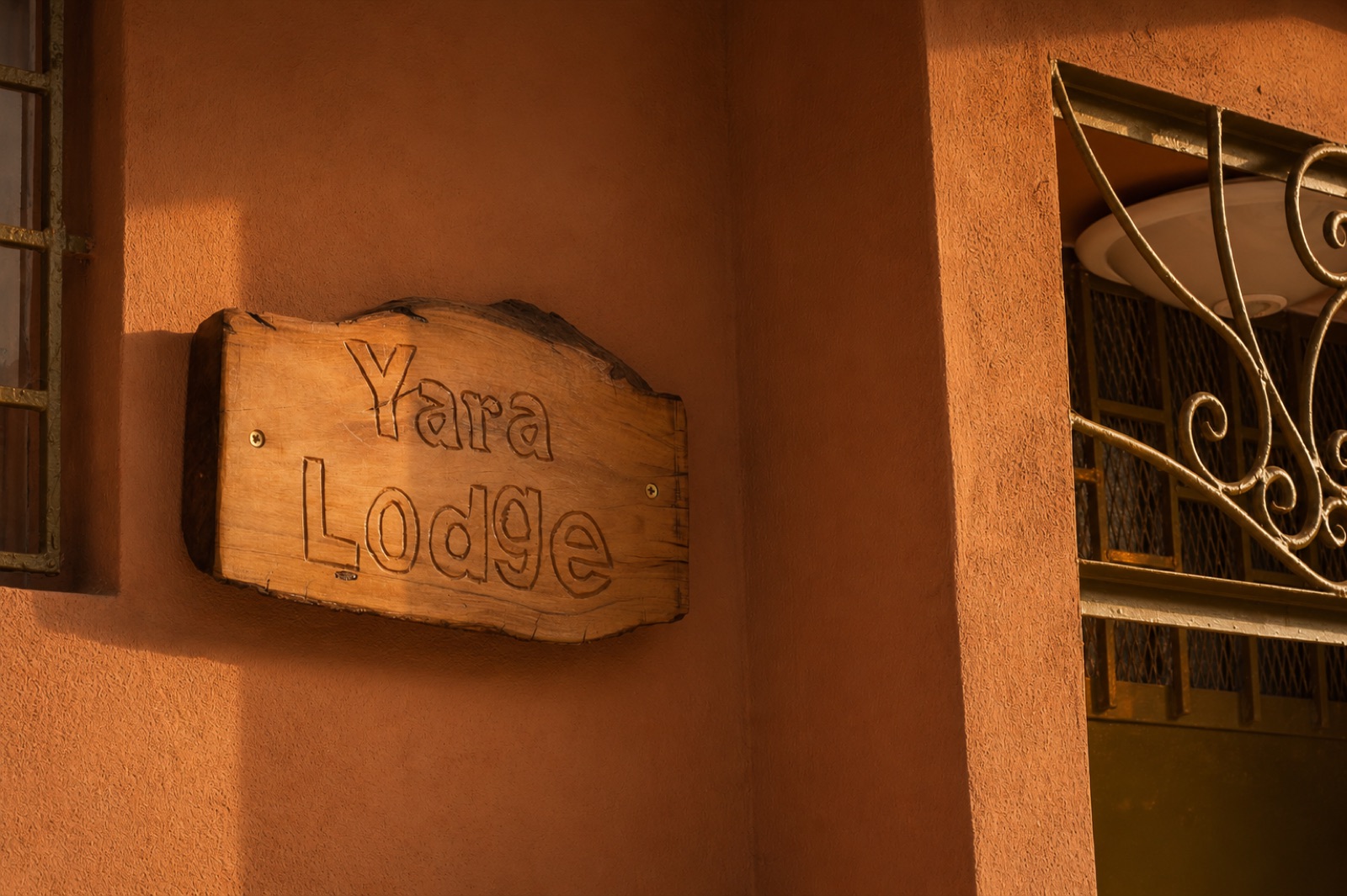 The carved Yara Lodge sign by the entrance