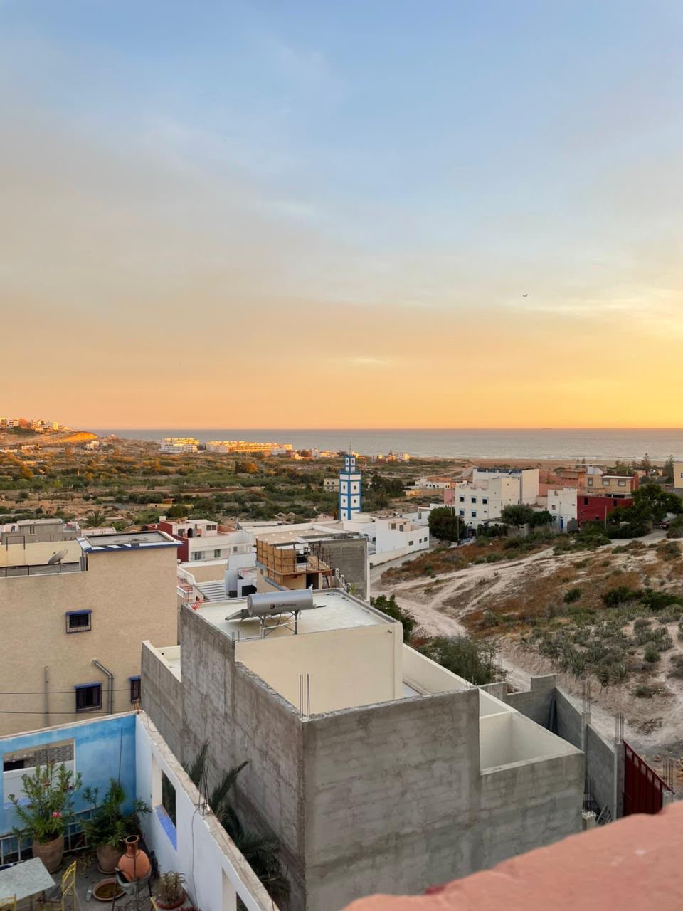 View from Yara Lodge over Tamraght Oufella to the ocean at sunset